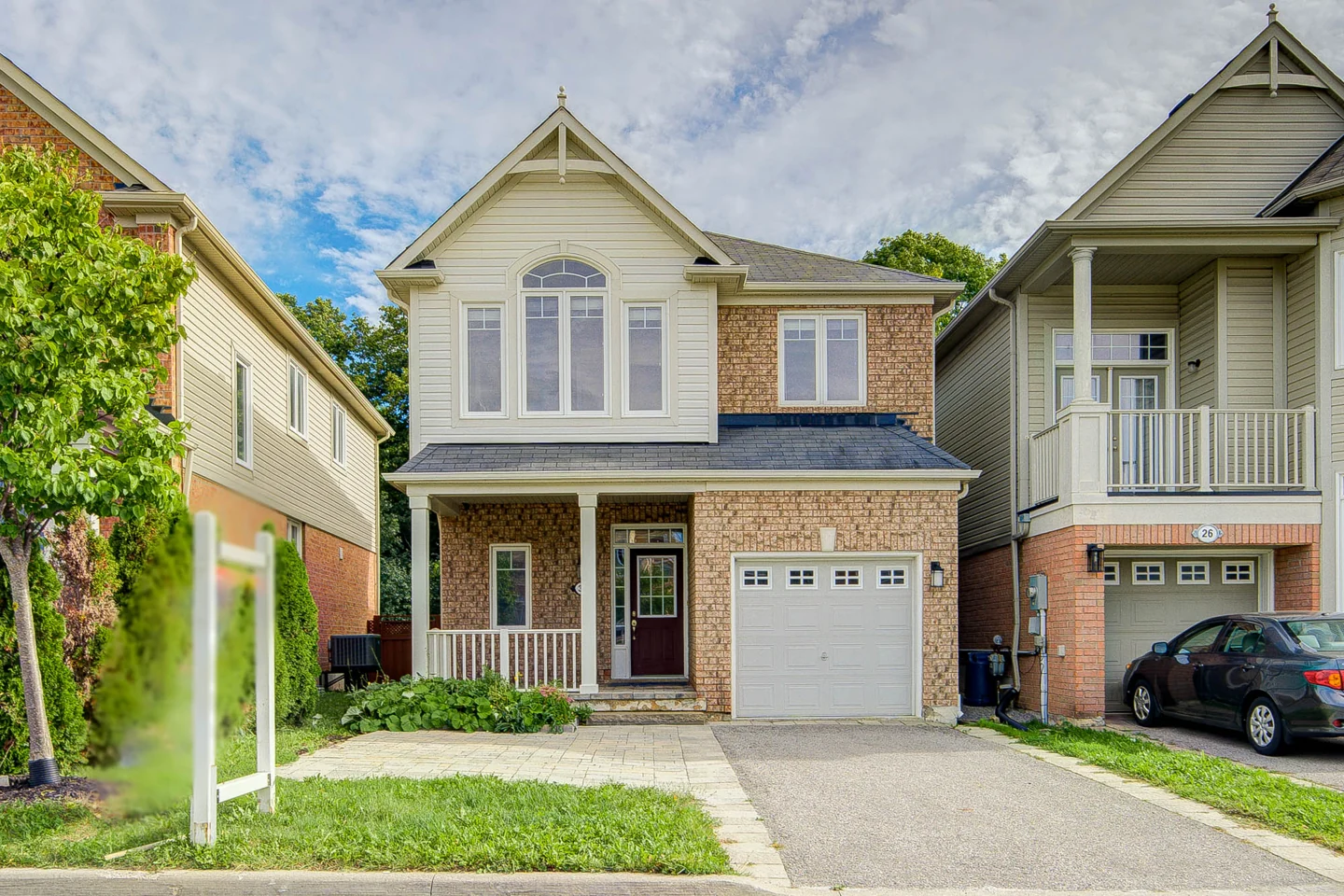 Front exterior of the two-storey home at 30 Elmeade Lane, Whitchurch-Stouffville